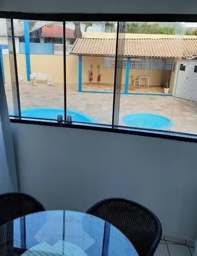 Apartamento azul no condomínio Mar de Cotovelo